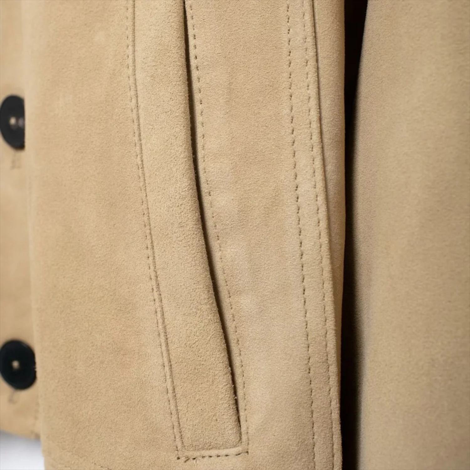 Tan suede jacket detail.