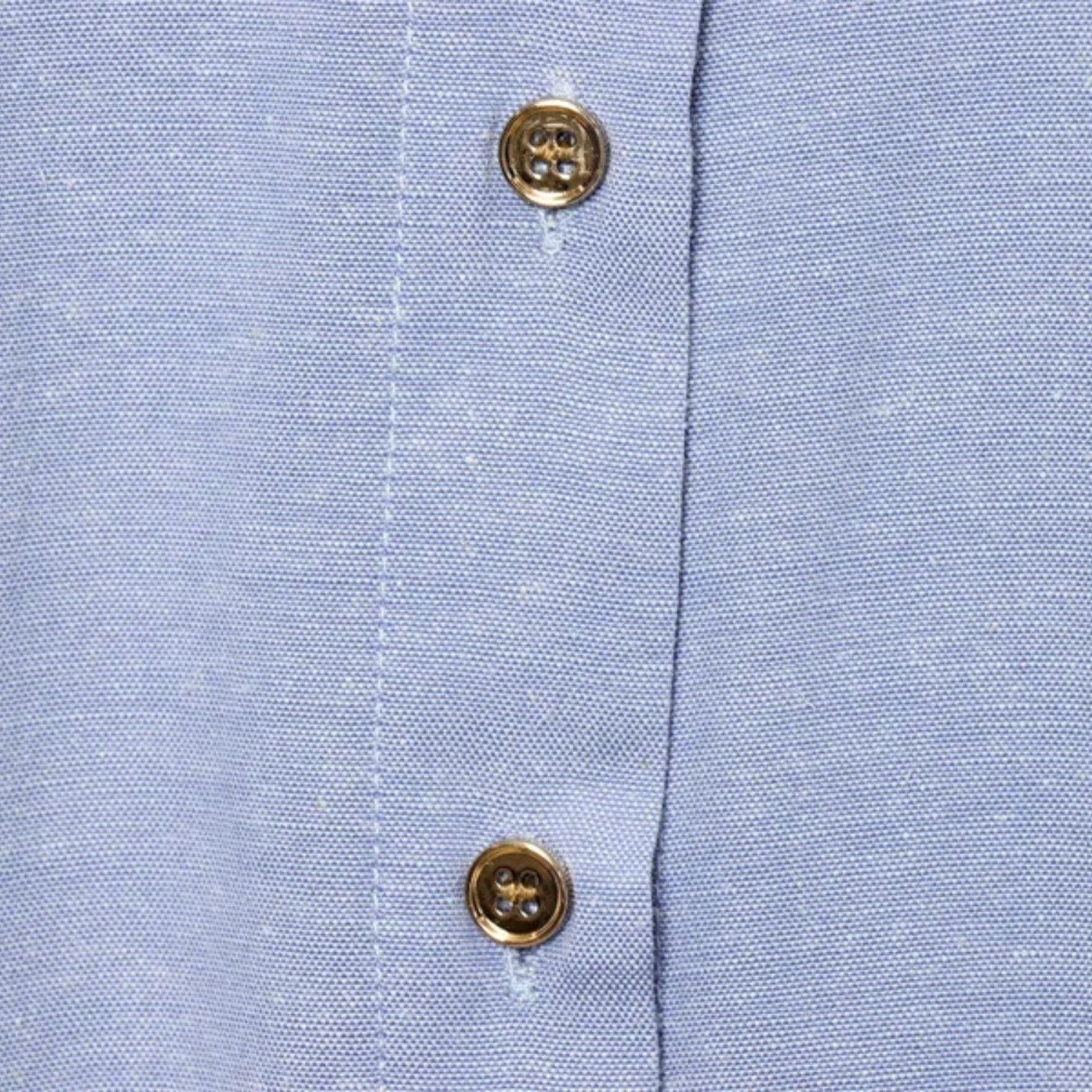 Blue linen shirt with gold buttons.