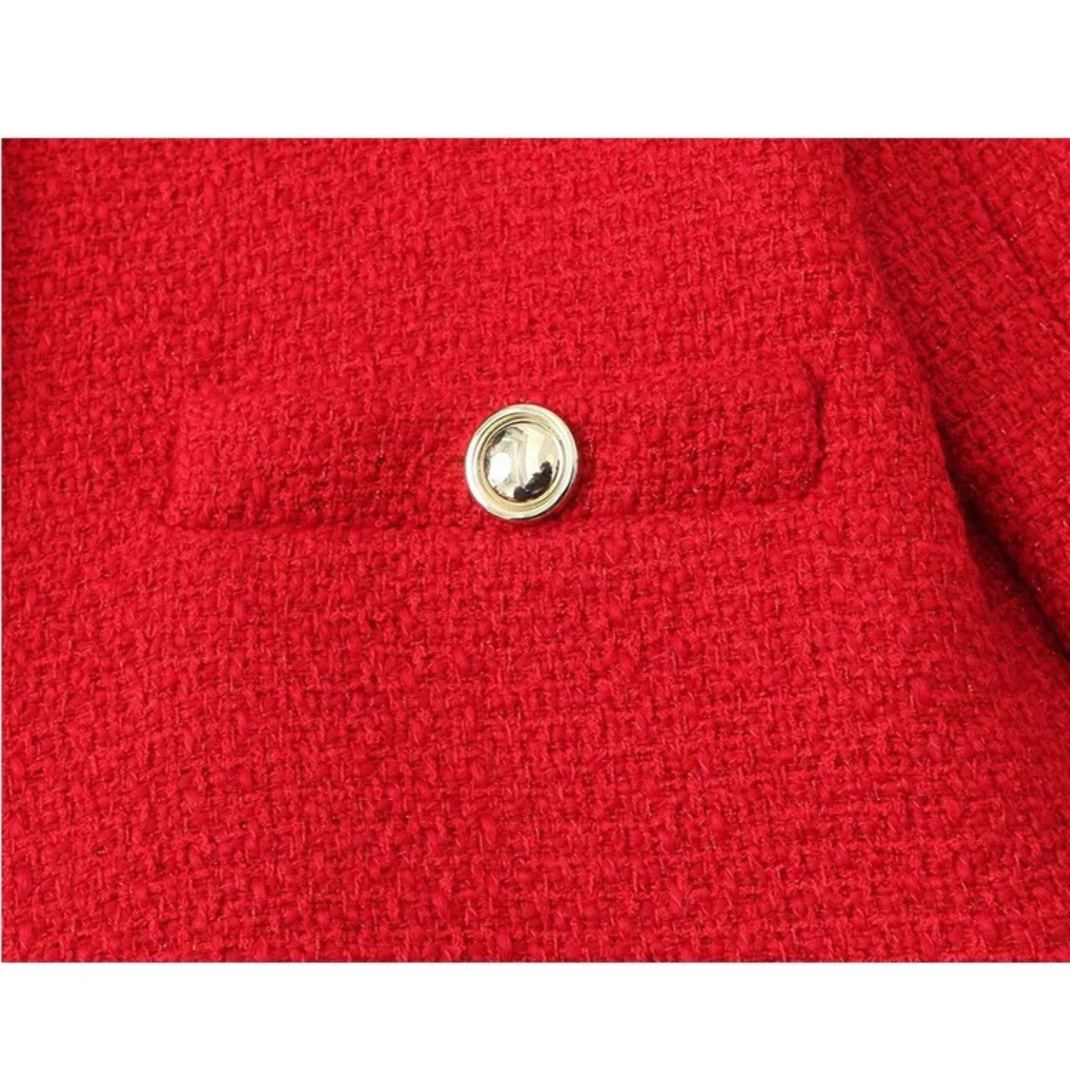 Red textured fabric with gold button.