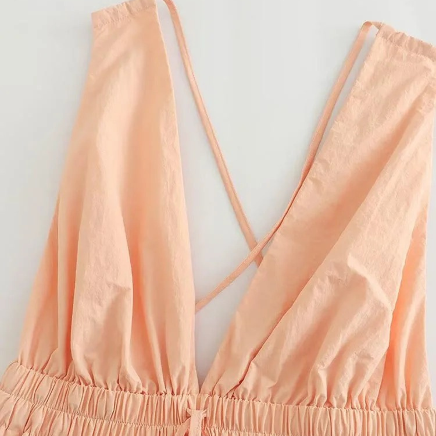 Peach-colored criss-cross back top.