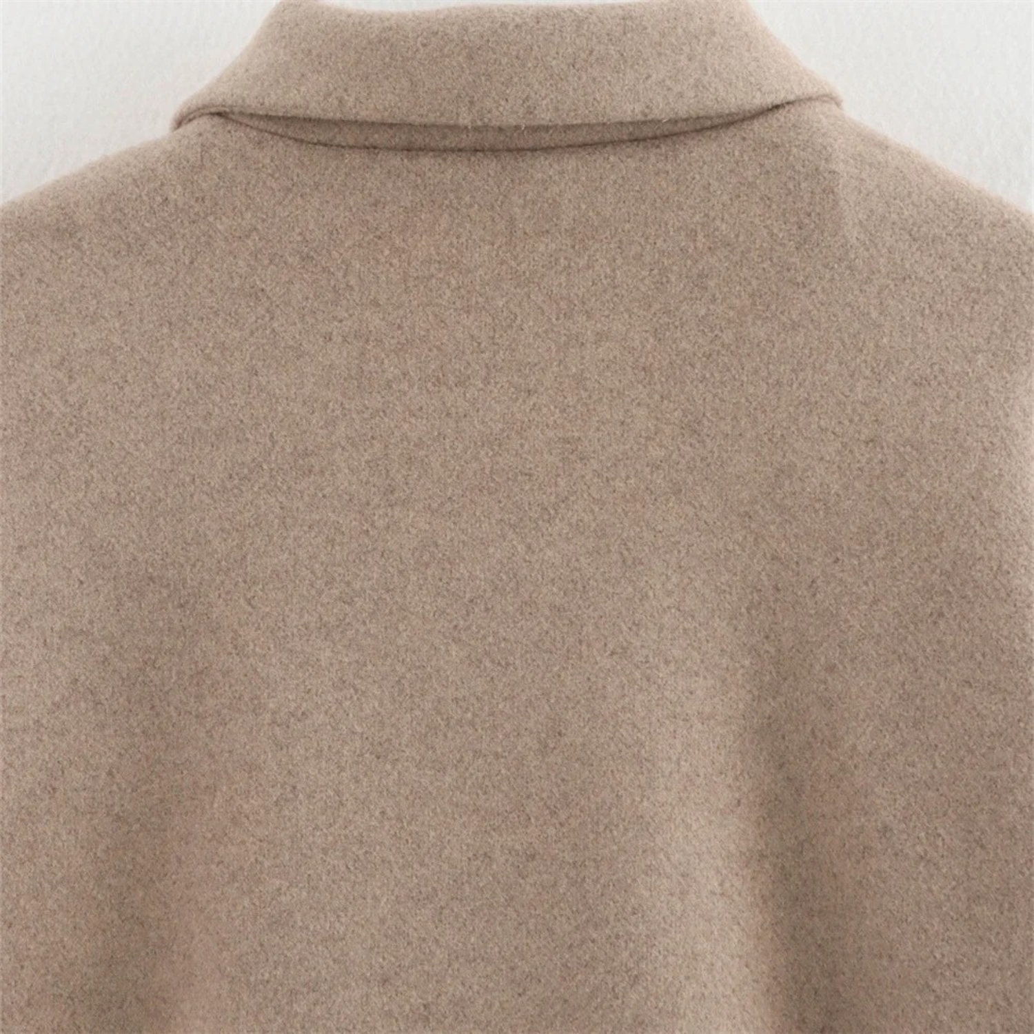Beige wool coat back.