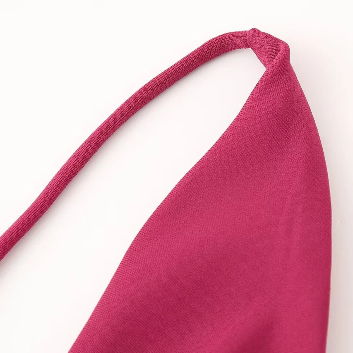Magenta fabric halter top.