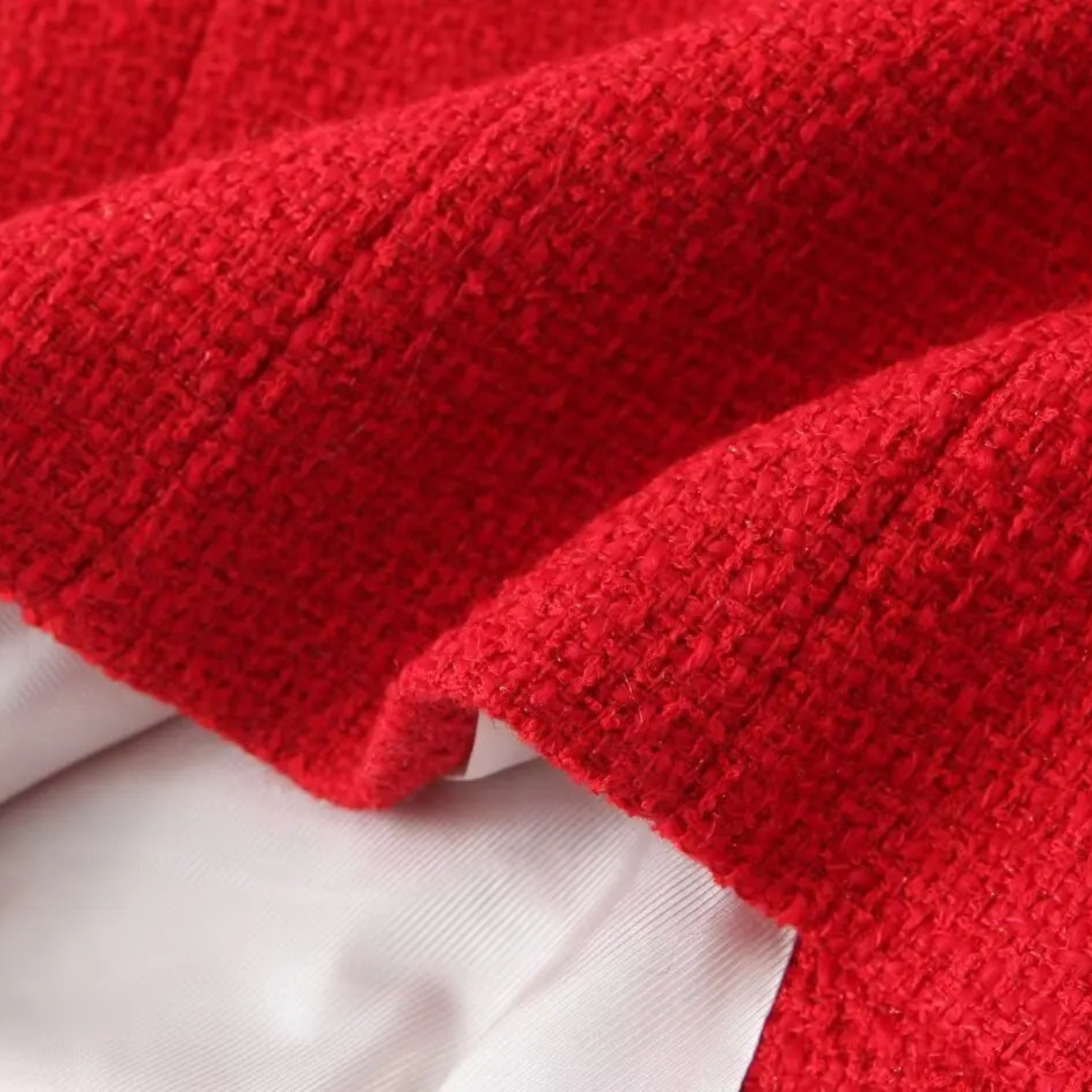 Red textured fabric with white lining.