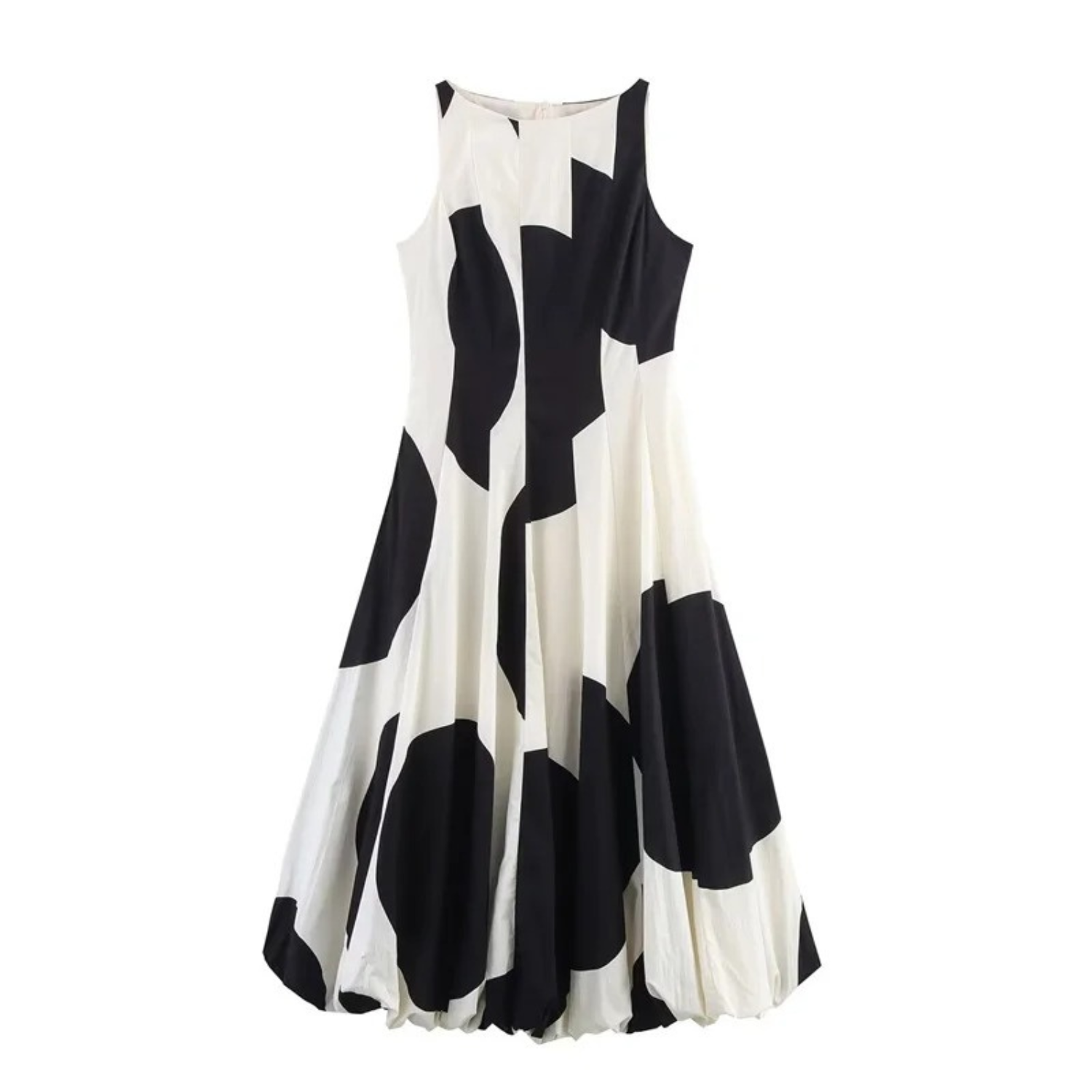 Sleeveless black and white patterned dress.